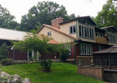 a house with a large deck and a pool