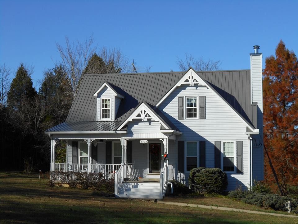 a white house with a metal roof